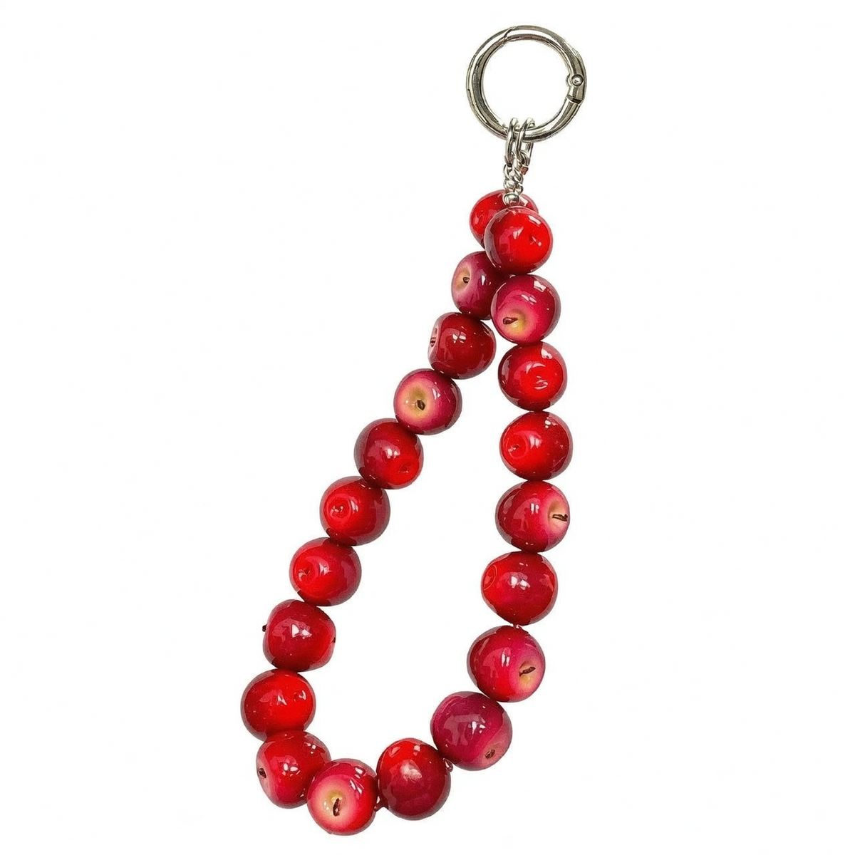 Red apple fruit phone charm held with a cozy grey sweater outfit