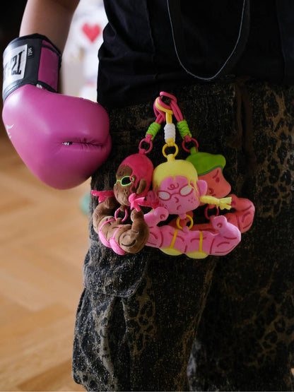 Buff anime girl bag charm clipped to pants with matching boxing gloves